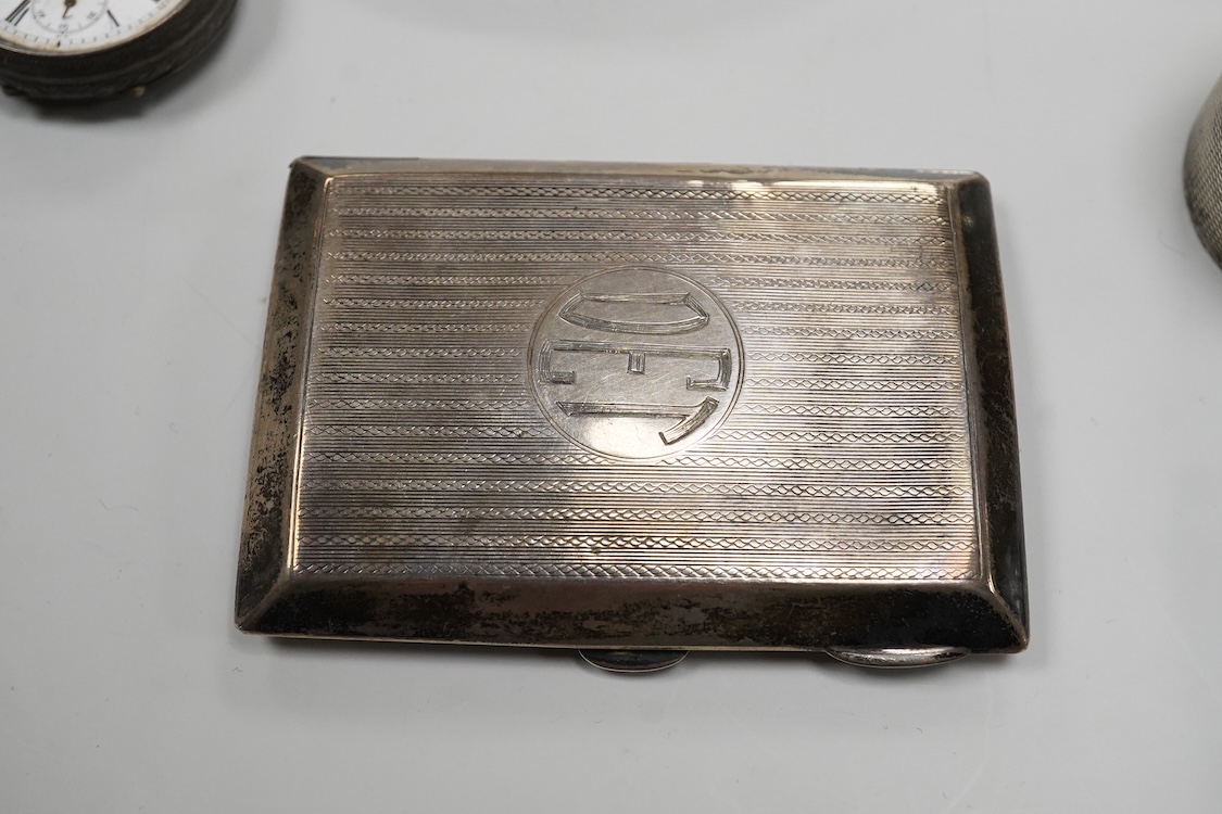 A collection of small silver to include a cigarette case, two napkin rings, three pairs of sugar tongs, a thimble, a lady's wrist watch and a mounted glass toilet jar. together with a 925 fob watch, a 935 mounted lighter